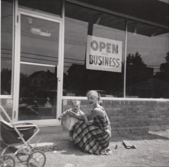 Mother and daughter in front of flower shop